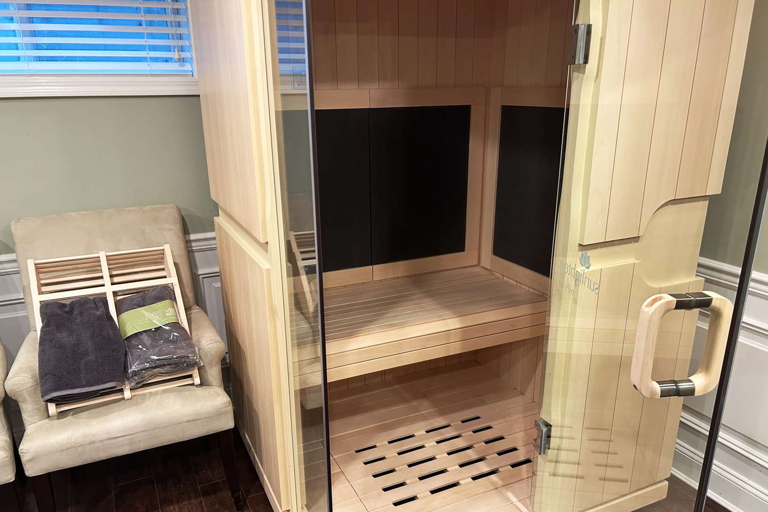 Sunlighten mPulse Smart Sauna Aspire set up next to a chair