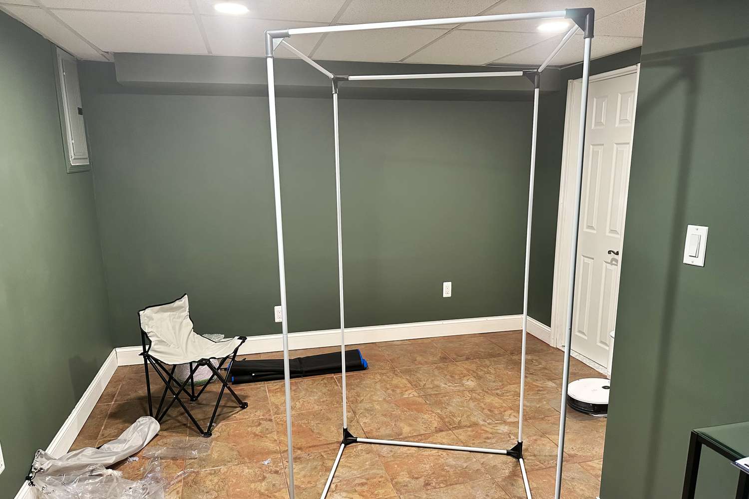 The armature of the SereneLife Full Size Portable Steam Sauna in a room